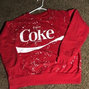 Coca-Cola trademark shirt.